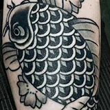 American Traditional tattoo of a black and gray koi fish with a heavy repeating scale pattern, created by Joshua Reynolds at House of Wolves Tattoo, Geelong
