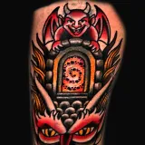 American Traditional tattoo of a snake-tongued devil with a gargoyle above a stone archway portal, created by Joshua Reynolds at House of Wolves Tattoo, Geelong