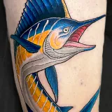 Large twisting blue marlin tattoo with a yellow belly, designed by Scott Russell at House of Wolves Tattoo, Geelong