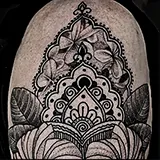 Ornamental half-sleeve tattoo featuring mandalas, lace patterns and hibiscus flowers with soft dotwork shading, designed by Mark Noel at House of Wolves Tattoo, Geelong